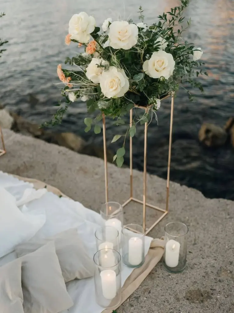 Barceloneta Beach marriage proposal setup showing luxury picnic pillows and candles on the sand, photo 6