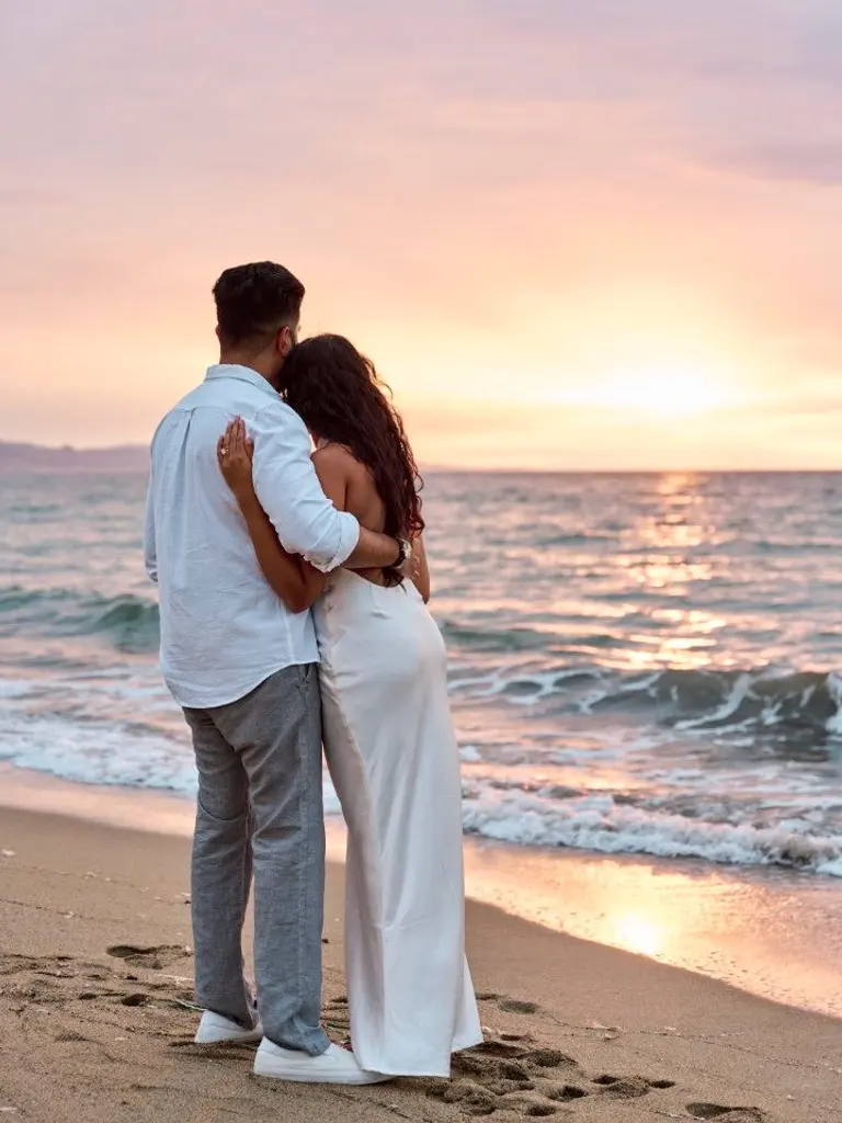 Barceloneta Beach marriage proposal setup showing luxury picnic pillows and candles on the sand, photo 8