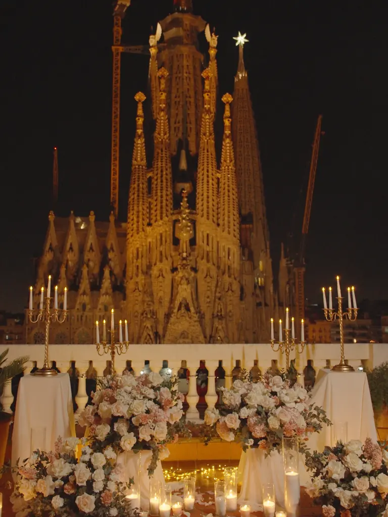 Sagrada Familia rooftop proposal setup in Barcelona showing floral arch and view 7
