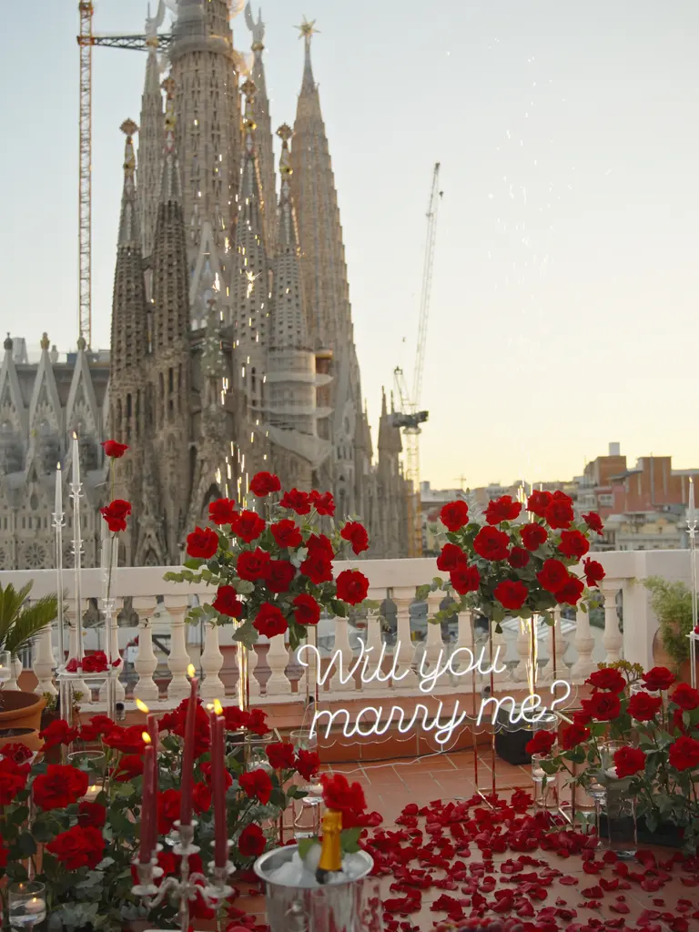 Sagrada Familia rooftop proposal setup in Barcelona showing floral arch and view 8