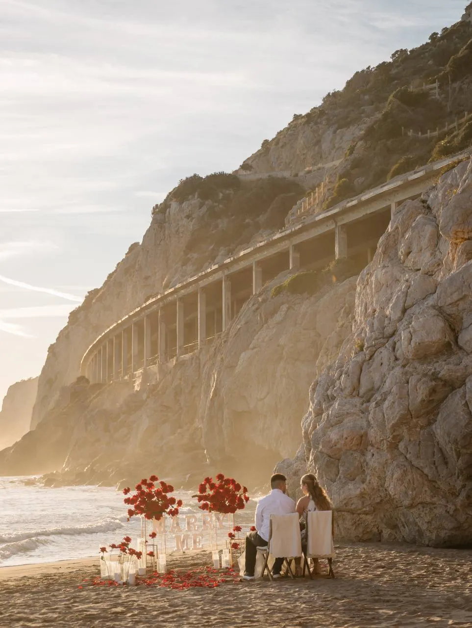 Sitges Sant Sebastia beach proposal setup view 1 during sunrise